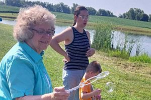 Blowing soap bubbles